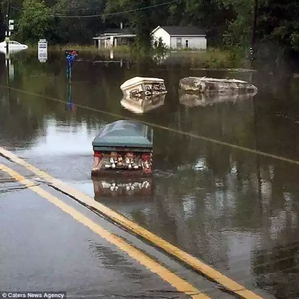 OMG! Caskets from graveyard float through the streets after devastating flood (Photos)